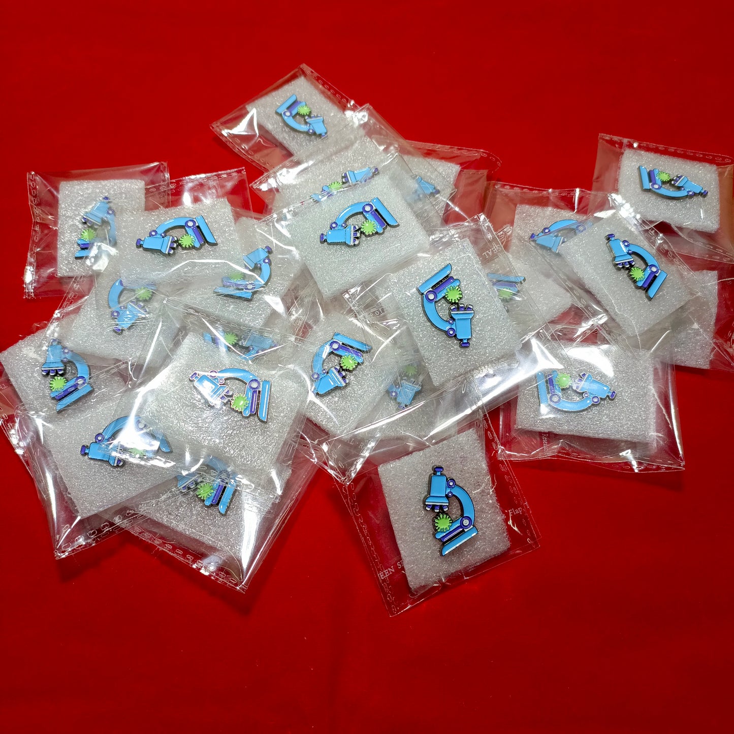 Lapel pins of microscope blue
