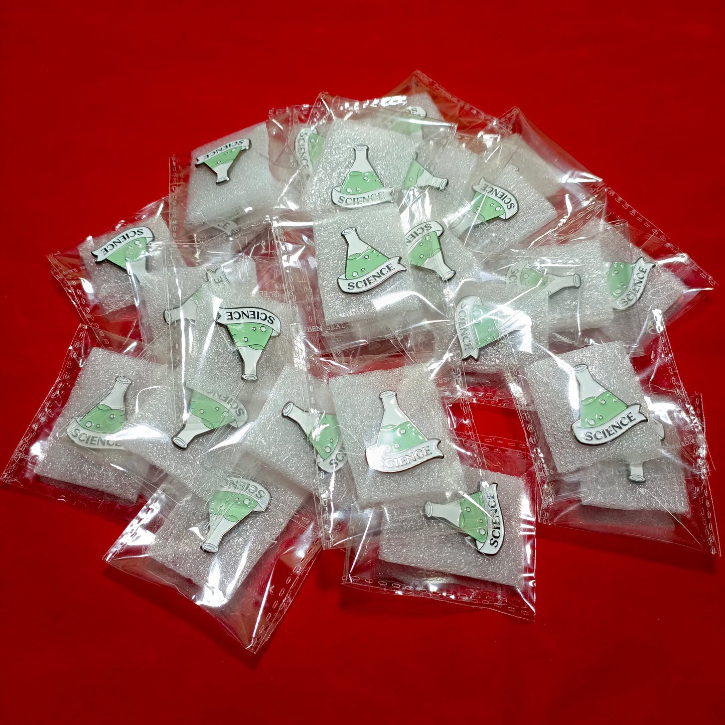 Lapel pins of beaker science