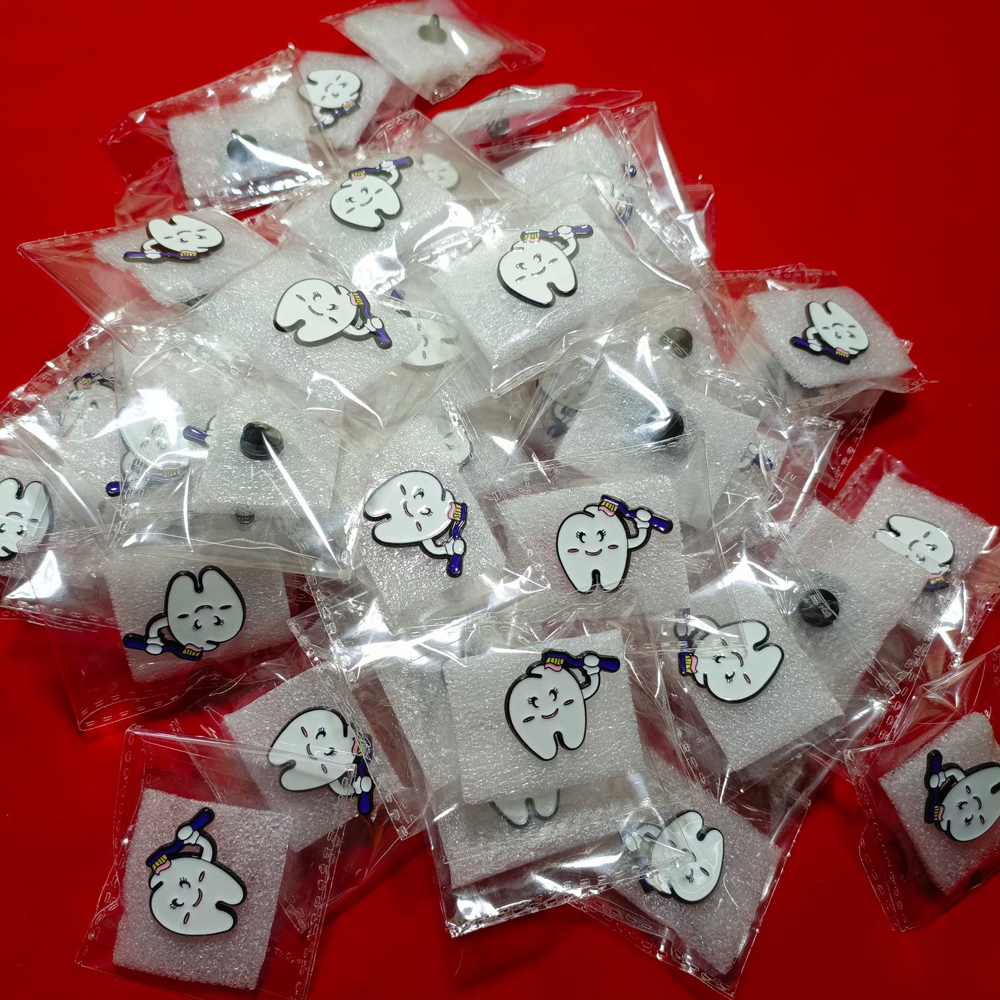 Lapel pins of tooth cartoon with brush