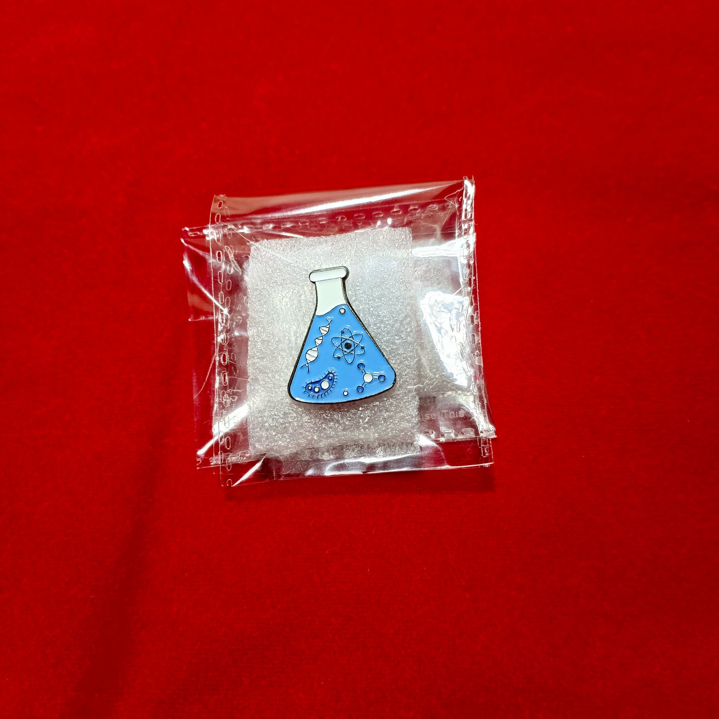 Lapel pins of blue beaker