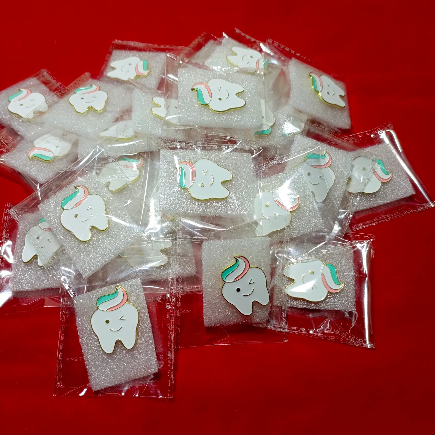 Lapel pins of smiling tooth cartoon