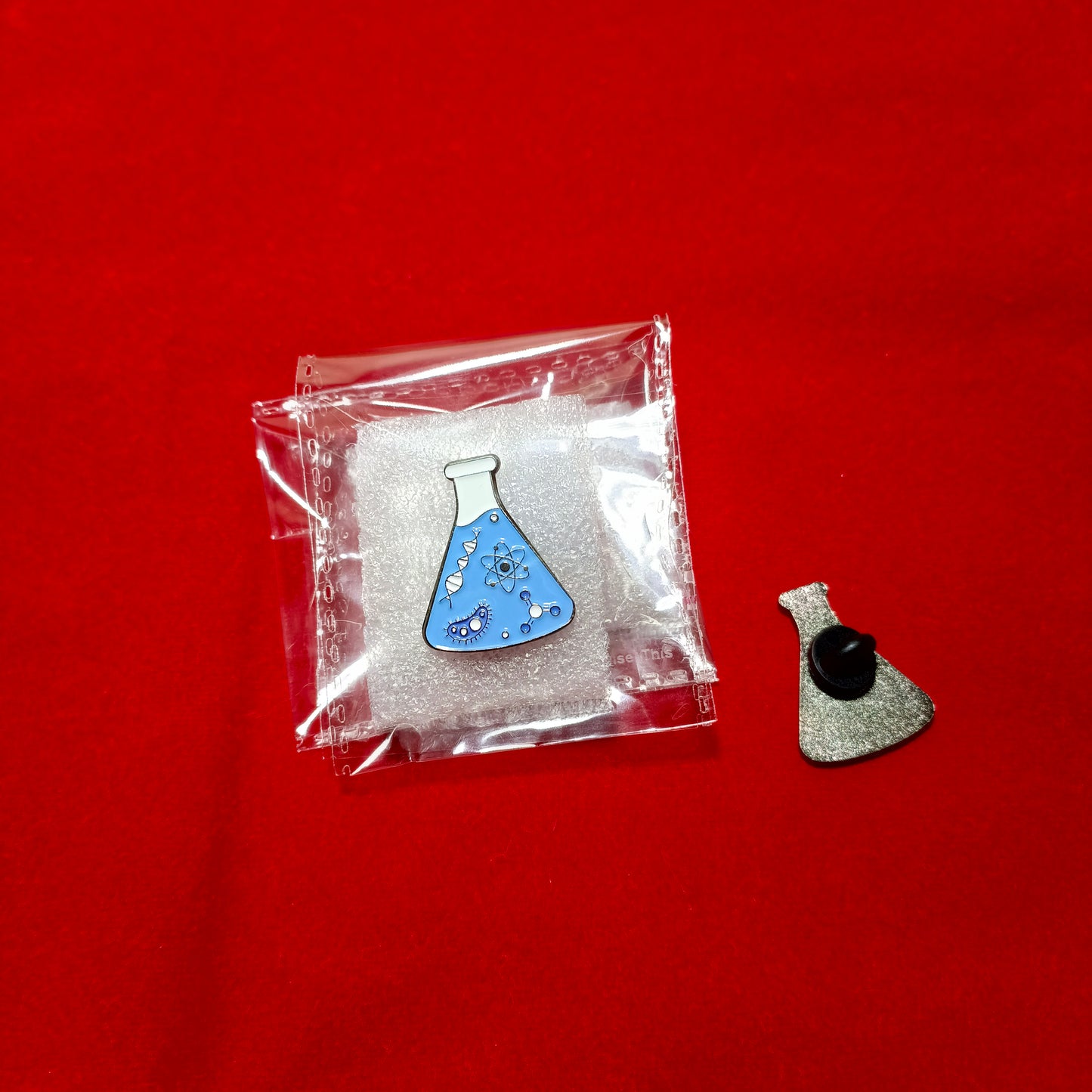 Lapel pins of blue beaker