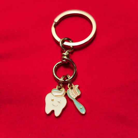 Keychain of tooth & brush enamel filled
