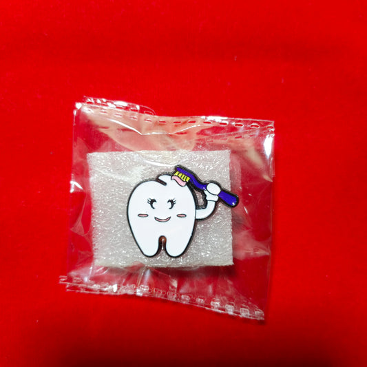 Lapel pins of tooth cartoon with brush