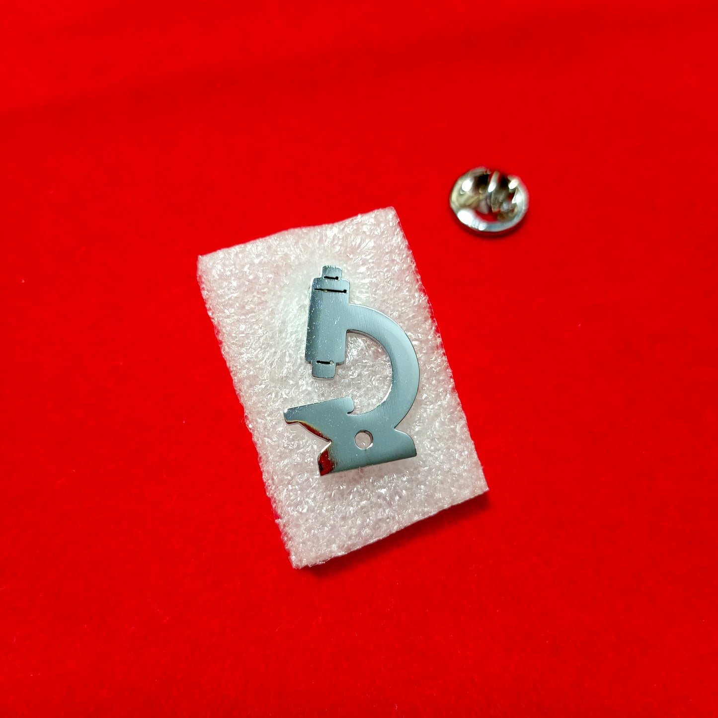 Lapel pins of SS Microscope