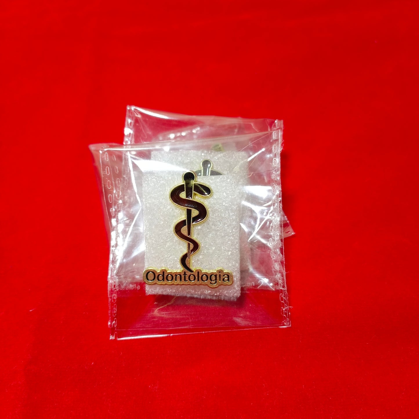 Lapel pins of Odontologia