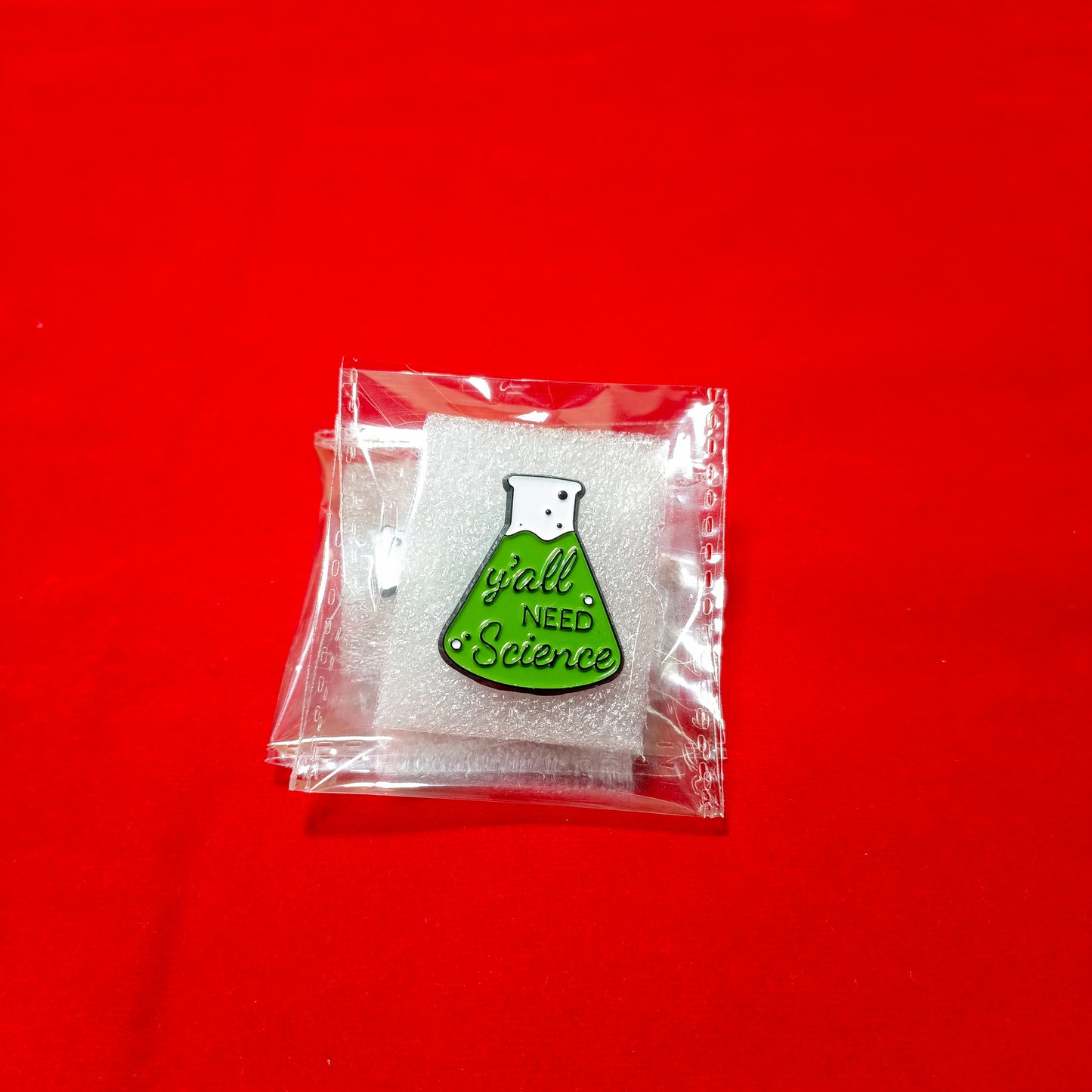 Lapel pins of beaker green