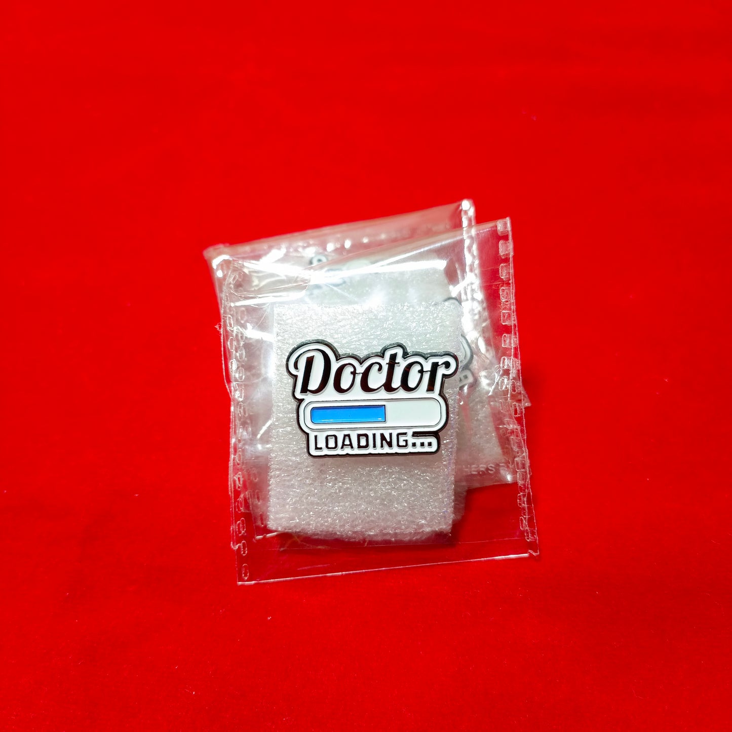 Lapel pins of Doctor Loading